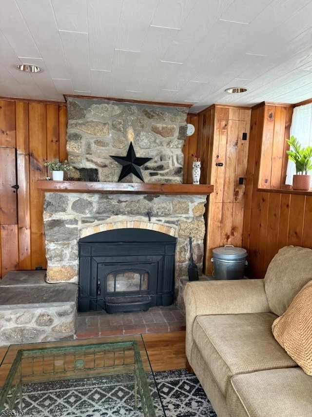 142 Lakeside Dr, Liberty Twp, NJ 07823 - living room with wooden walls, a wood stove, and wood finished floors