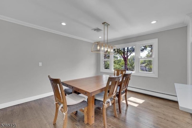 26 Robert St, Mount Olive Twp, NJ 07836 - dining room with a baseboard heating unit, ornamental molding, wood finished floors, recessed lighting, and a chandelier