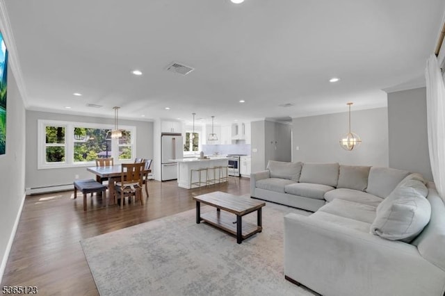 26 Robert St, Mount Olive Twp, NJ 07836 - living area featuring ornamental molding, baseboard heating, light wood-type flooring, recessed lighting, and a chandelier