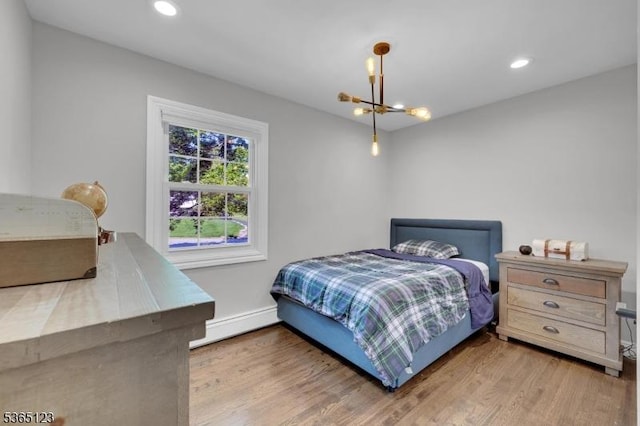 26 Robert St, Mount Olive Twp, NJ 07836 - bedroom with a chandelier, wood finished floors, a baseboard radiator, and recessed lighting