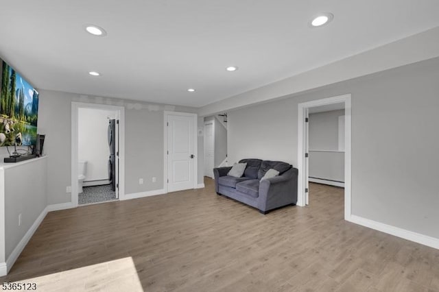 26 Robert St, Mount Olive Twp, NJ 07836 - living room with baseboard heating, recessed lighting, and wood finished floors