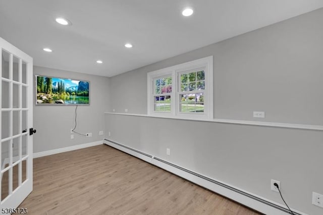 26 Robert St, Mount Olive Twp, NJ 07836 - empty room with baseboard heating, wood finished floors, and recessed lighting