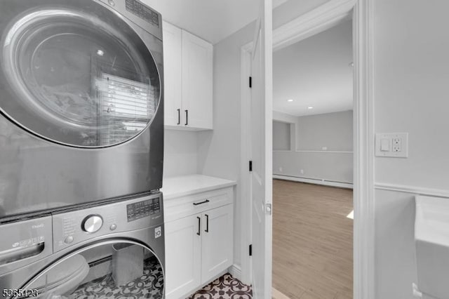 26 Robert St, Mount Olive Twp, NJ 07836 - washroom with cabinet space, baseboard heating, and stacked washer and clothes dryer