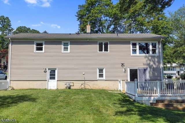 26 Robert St, Mount Olive Twp, NJ 07836 - rear view of house featuring a lawn and a wooden deck
