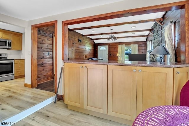 76 Hillside Rd, Sparta Twp, NJ 07871 - kitchen featuring appliances with stainless steel finishes, light wood-style floors, wood walls, light brown cabinetry, and beamed ceiling