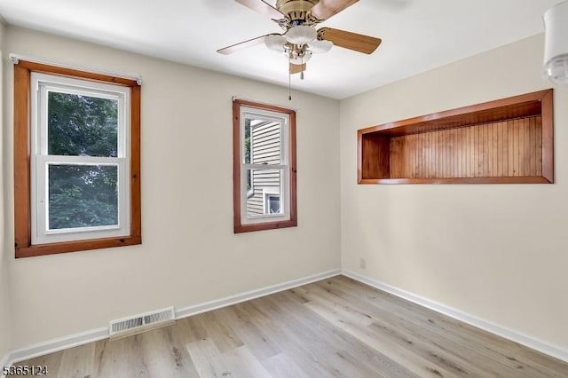 76 Hillside Rd, Sparta Twp, NJ 07871 - empty room with healthy amount of natural light, light wood-type flooring, and ceiling fan