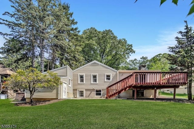 76 Hillside Rd, Sparta Twp, NJ 07871 - back of property with a lawn, a deck, and stairway