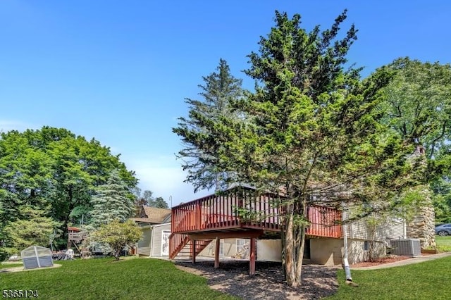 76 Hillside Rd, Sparta Twp, NJ 07871 - rear view of property with a wooden deck, stairway, and a lawn