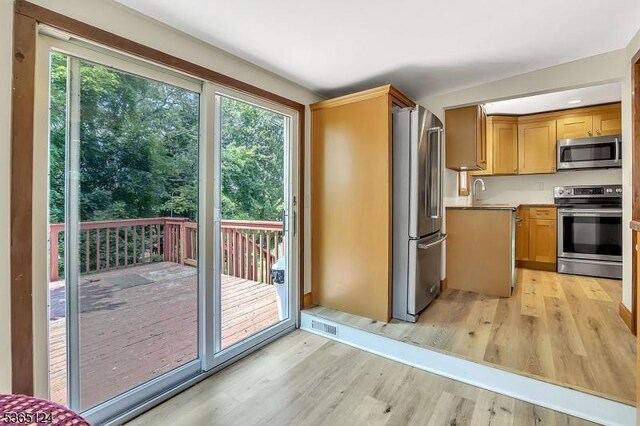 76 Hillside Rd, Sparta Twp, NJ 07871 - kitchen featuring appliances with stainless steel finishes, light wood-style floors, and light countertops