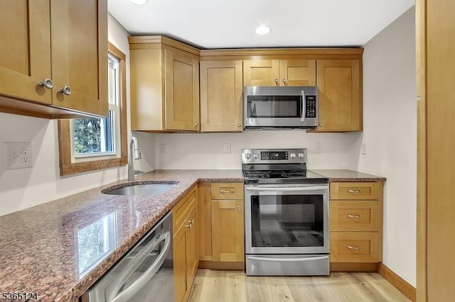 76 Hillside Rd, Sparta Twp, NJ 07871 - kitchen with stainless steel appliances, light wood-type flooring, and dark stone countertops