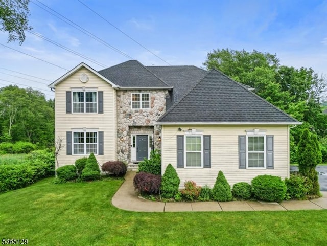 176 Randolph Ave, Mine Hill Twp, NJ 07803 - traditional home with a front lawn, stone siding, and a shingled roof