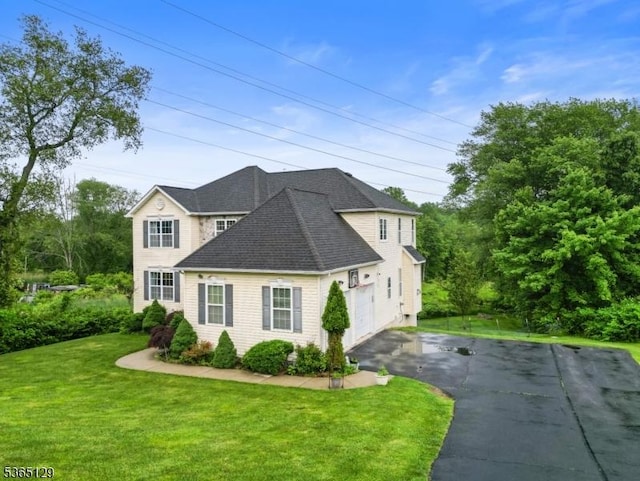176 Randolph Ave, Mine Hill Twp, NJ 07803 - view of front of home featuring asphalt driveway, a front yard, and a shingled roof
