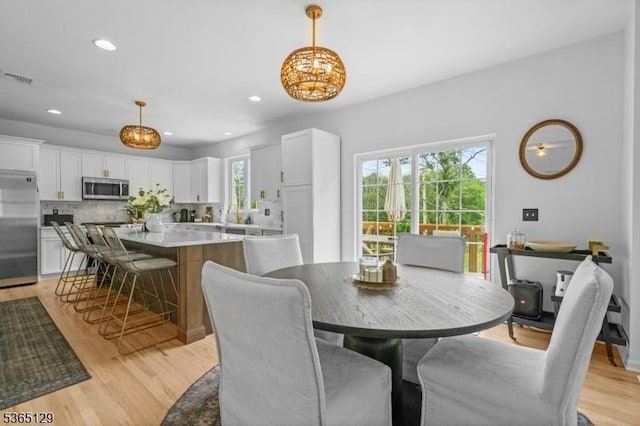 176 Randolph Ave, Mine Hill Twp, NJ 07803 - dining space with a chandelier, light wood-style floors, and recessed lighting