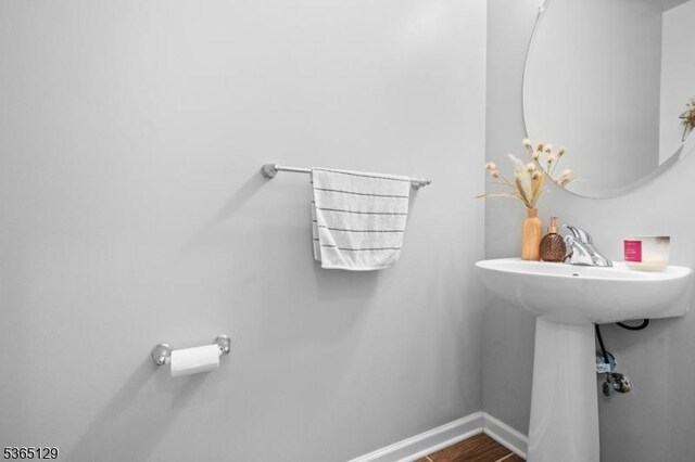 176 Randolph Ave, Mine Hill Twp, NJ 07803 - bathroom with baseboards and wood finished floors