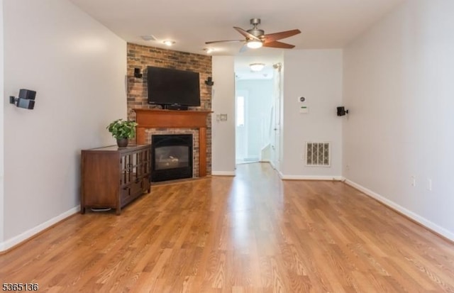 63 Rockcreek Ter, Riverdale Boro, NJ 07457 - unfurnished living room with a ceiling fan, a fireplace, and wood finished floors