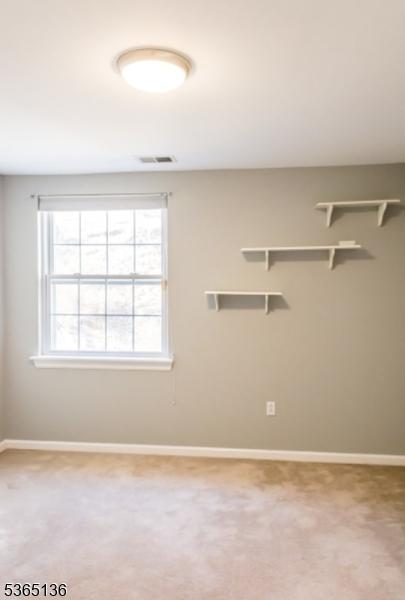 63 Rockcreek Ter, Riverdale Boro, NJ 07457 - carpeted empty room featuring baseboards