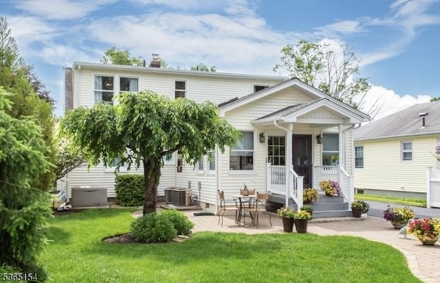 425 Broadway, Pompton Lakes Boro, NJ 07442 - back of house featuring a yard, a chimney, and a patio area