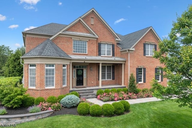 6 Cope Ct, Hillsborough Twp, NJ 08844 - view of front facade featuring covered porch, a front yard, and brick siding