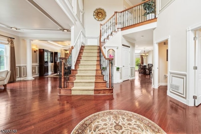 6 Cope Ct, Hillsborough Twp, NJ 08844 - foyer with hardwood / wood-style floors, decorative columns, stairway, a decorative wall, and a wainscoted wall