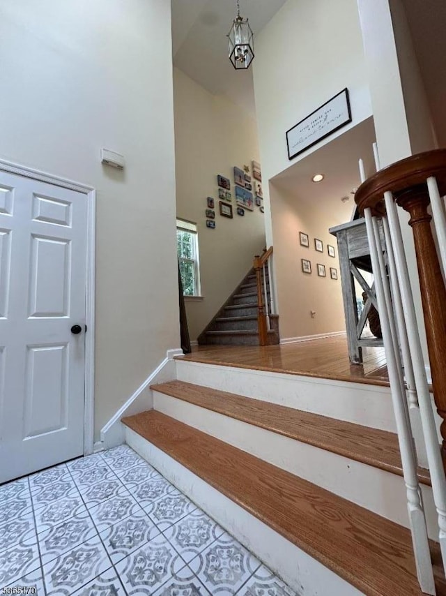 149 Wingate Dr, Independence Twp, NJ 07840 - stairway with a towering ceiling and tile patterned floors