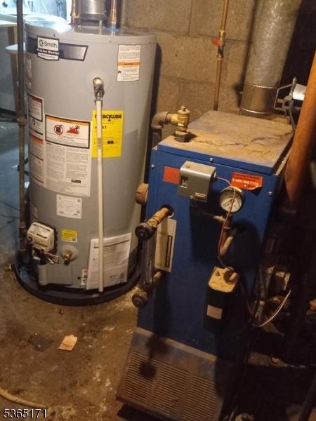1368 E 2nd St, Plainfield City, NJ 07062 - utility room featuring gas water heater and a heating unit
