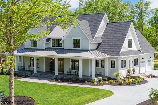 2 County Line Rd, Mendham Boro, NJ 07945 - modern inspired farmhouse with a standing seam roof, a porch, a front lawn, concrete driveway, and a garage