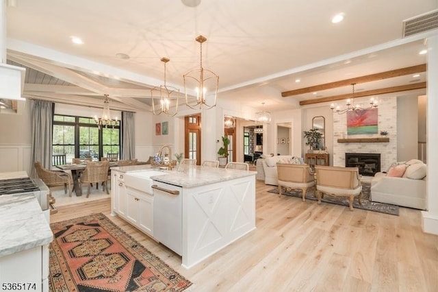 2 County Line Rd, Mendham Boro, NJ 07945 - kitchen featuring a chandelier, dishwasher, white cabinetry, light wood-style flooring, and open floor plan