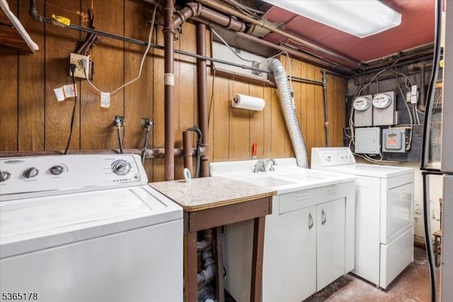 267 William St, Belleville Twp, NJ 07109 - laundry area with washing machine and clothes dryer and wooden walls