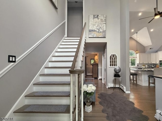 26 Knollwood Rd, Hanover Twp, NJ 07981 - stairs with high vaulted ceiling, a baseboard heating unit, a ceiling fan, wood finished floors, and recessed lighting