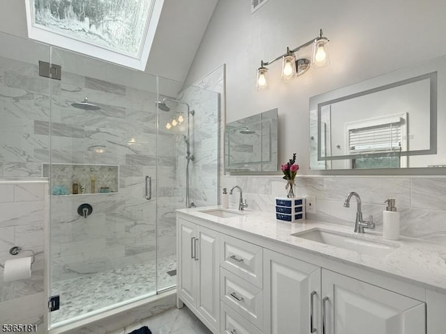 26 Knollwood Rd, Hanover Twp, NJ 07981 - full bathroom with vaulted ceiling, double vanity, a shower stall, a skylight, and tasteful backsplash