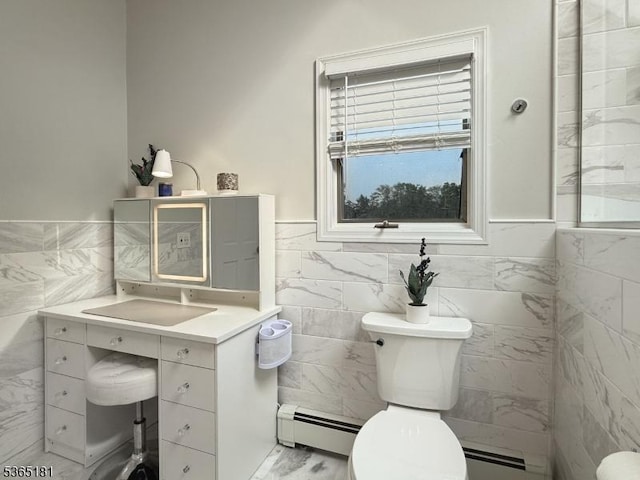 26 Knollwood Rd, Hanover Twp, NJ 07981 - half bath with tile walls, baseboard heating, vanity, a wainscoted wall, and a baseboard radiator