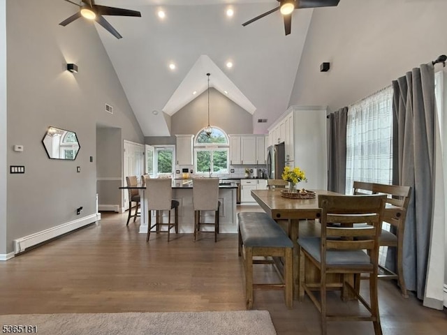 26 Knollwood Rd, Hanover Twp, NJ 07981 - dining space with ceiling fan, high vaulted ceiling, baseboard heating, and dark wood-type flooring