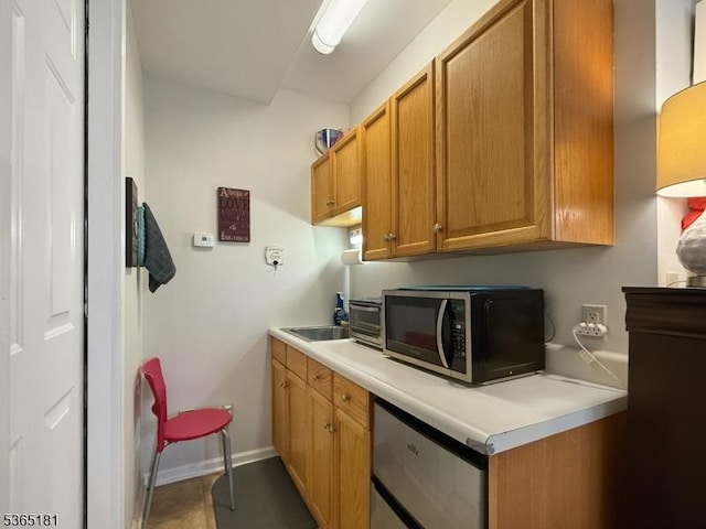 26 Knollwood Rd, Hanover Twp, NJ 07981 - kitchen featuring light countertops, brown cabinetry, and fridge