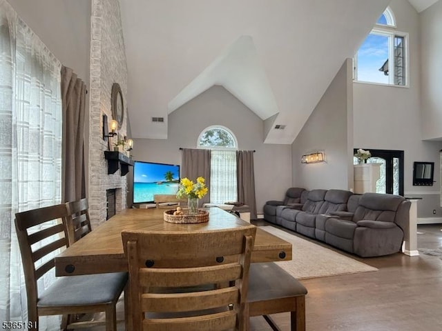 26 Knollwood Rd, Hanover Twp, NJ 07981 - living area featuring healthy amount of natural light, high vaulted ceiling, wood finished floors, and a stone fireplace