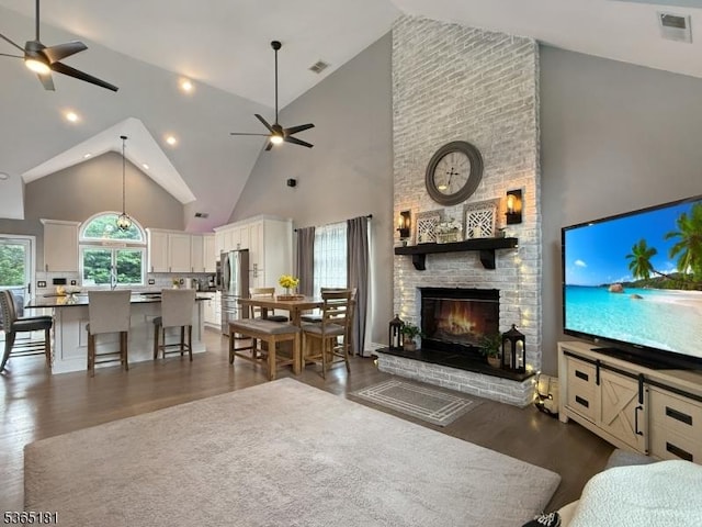 26 Knollwood Rd, Hanover Twp, NJ 07981 - living area with a ceiling fan, high vaulted ceiling, dark wood-style flooring, and a brick fireplace