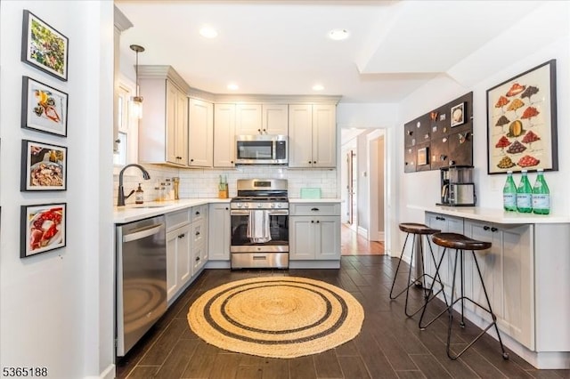 35 Elm Ct, South Orange Village Twp, NJ 07079 - kitchen with stainless steel appliances, dark wood-style flooring, light countertops, tasteful backsplash, and recessed lighting
