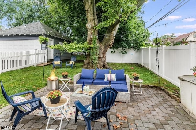 35 Elm Ct, South Orange Village Twp, NJ 07079 - fenced backyard with a patio area, an outdoor hangout area, a detached garage, and an outbuilding