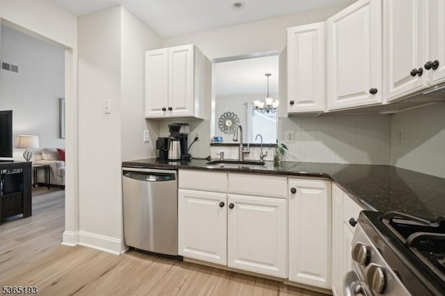 9 Mahogany Way, Randolph Twp, NJ 07869 - kitchen featuring stainless steel appliances, a chandelier, light wood-type flooring, white cabinetry, and dark stone countertops
