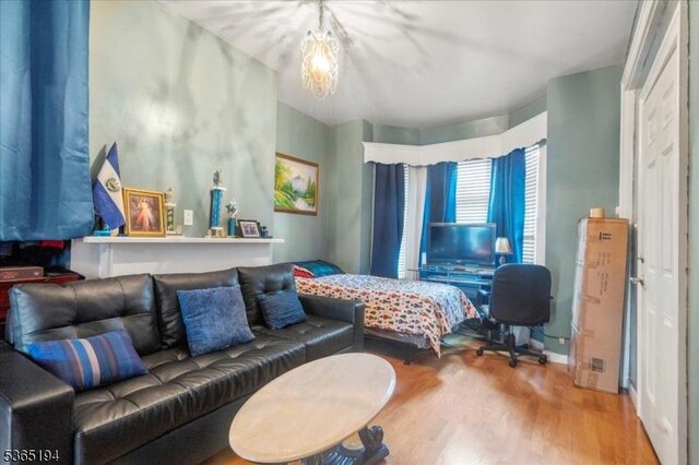 93 Garside St, Newark City, NJ 07104 - bedroom featuring a chandelier and wood finished floors