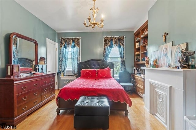 93 Garside St, Newark City, NJ 07104 - bedroom with a chandelier and light wood finished floors