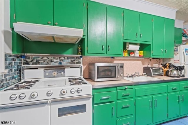 93 Garside St, Newark City, NJ 07104 - kitchen featuring white range with gas stovetop, under cabinet range hood, stainless steel microwave, backsplash, and light countertops