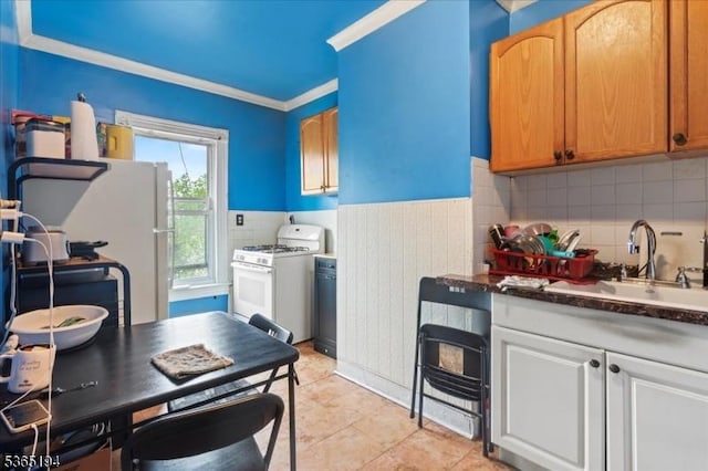 93 Garside St, Newark City, NJ 07104 - kitchen featuring white appliances, dark countertops, crown molding, tasteful backsplash, and light tile patterned floors