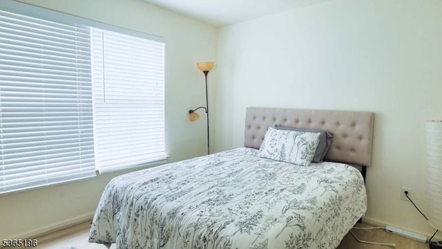 228 Windmill Ct, Lopatcong Twp, NJ 08865 - bedroom featuring baseboards and wood finished floors