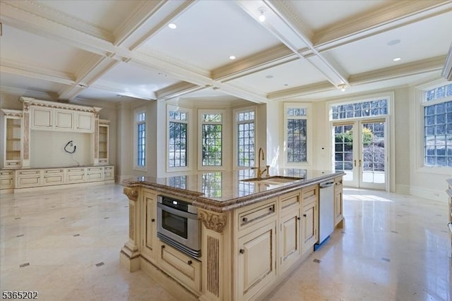 11 Margo Way, Alpine Boro, NJ 07620 - kitchen featuring french doors, coffered ceiling, cream cabinets, appliances with stainless steel finishes, and a kitchen island with sink