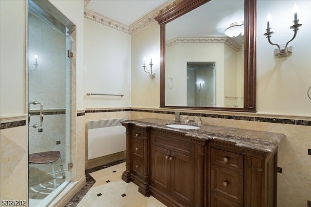 11 Margo Way, Alpine Boro, NJ 07620 - full bathroom with tile walls, wainscoting, a shower stall, inlaid floor details, and vanity