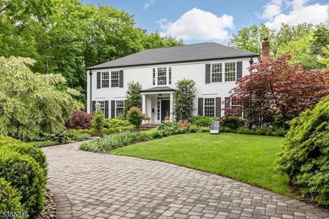 95 Green Ave, Madison Boro, NJ 07940 - colonial home featuring a chimney and a front lawn