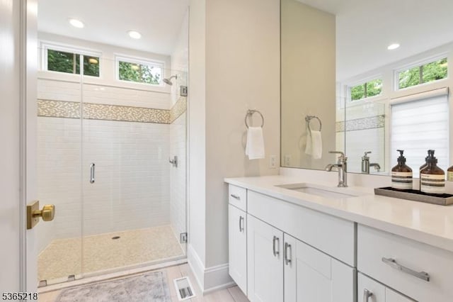 95 Green Ave, Madison Boro, NJ 07940 - bathroom with healthy amount of natural light, vanity, a shower stall, and recessed lighting
