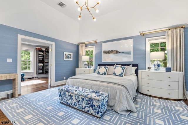 95 Green Ave, Madison Boro, NJ 07940 - bedroom with a chandelier, wood finished floors, a spacious closet, and vaulted ceiling