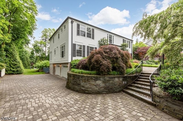 95 Green Ave, Madison Boro, NJ 07940 - colonial inspired home with a garage, stairway, and decorative driveway
