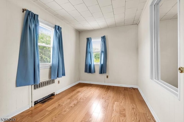 13 S St, Madison Boro, NJ 07940 - unfurnished room with radiator heating unit and light wood-type flooring